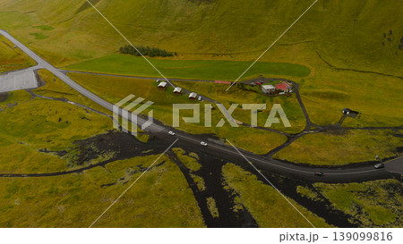 Aerial View of Rural Iceland with Red Roofed House and Green Fields 139099816