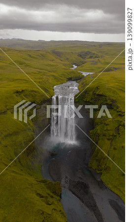 Aerial View of Skogafoss Waterfall and Surrounding Mossy Terrain Aerial View of Skogafoss Waterfall and Surrounding Mossy Terrain 139099827