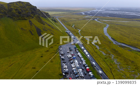 Aerial View of Parking Area by Moss Covered Cliff in Iceland Aerial View of Parking Area by Moss Covered Cliff in Iceland 139099835