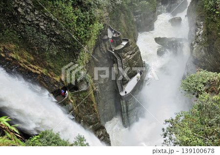 Exploring the "Pailon del Diablo" waterfall in a lush canyon in Ecuador. Exploring the "Pailon del Diablo" waterfall in a lush canyon in Ecuador. 139100678
