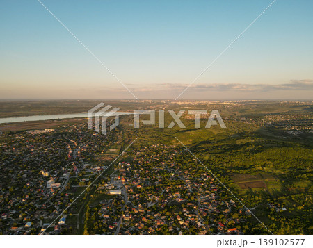 Panorama Countryside River Estuary At Dusk, Aerial Overview Of Expanding Settlements And Patchwork Farmland, Greenbelt And Marsh Edges Visible, Planner Survey Perspective For Development Panorama Countryside River Estuary At Dusk, Aerial Overview Of Expanding Settlements And Patchwork Farmland, Greenbelt And Marsh Edges Visible, Planner Survey Perspective For Development 139102577