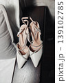 White Bridal Heels Placed On Bench, Soft Natural Light Highlighting Satin Straps And Pointed Toes, Subtle Rhinestone Detail, Muted Neutral Palette Evoking Wedding Morning Calm And Elegant 139102785