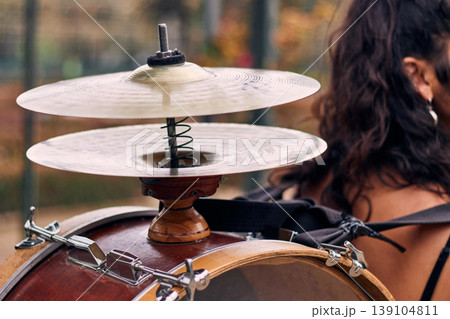 Detail of a musical instrument, bass drum and cymbals belonging to a chinchinera, a female street musician who dances and plays her drum in the streets. Chilean heritage, Chilean culture, national 139104811