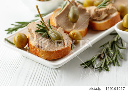 Sandwiches with pate on a white wooden table. 139105967