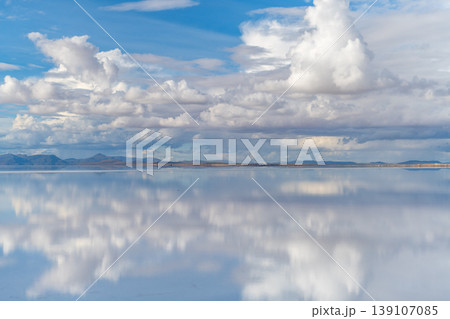 Serene sky reflection on salar de uyuni water in bolivia Serene sky reflection on salar de uyuni water in bolivia 139107085