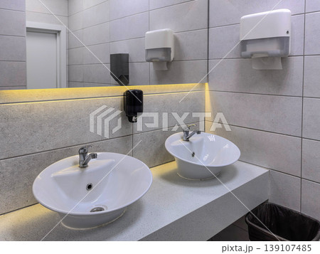 Modern Public Restroom Vanity with Double Sinks Modern Public Restroom Vanity with Double Sinks 139107485