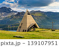 Modern pyramid chapel of Mont Cenis under dramatic sky, French Alps 139107951