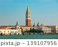 St. Mark's Campanile rising above the historic buildings, the domes of St. Mark's Basilica and the Doge's Palace in Venice, Italy. 139107956