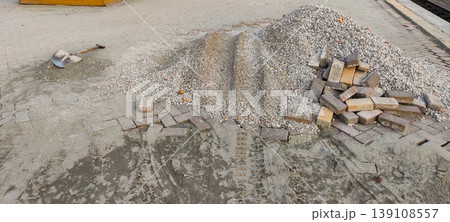 Footpath construction near railway line with bricks and shovel 139108557