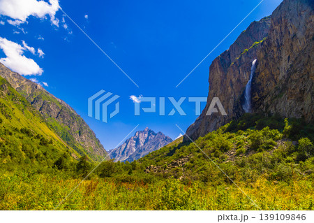 Majestic waterfall cascading down rugged mountains Majestic waterfall cascading down rugged mountains 139109846