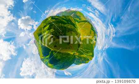 Aerial little planet view of green mountains and valleys with clouds Aerial little planet view of green mountains and valleys with clouds 139109870