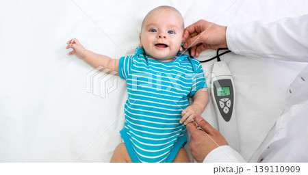 Newborn hearing screening and diagnosis at the hospital. Baby having hearing screening, Otoacoustic Emissions Newborn hearing screening and diagnosis at the hospital. Baby having hearing screening, Otoacoustic Emissions 139110909