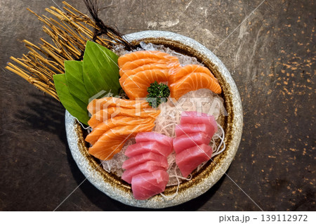 Fresh Tuna Salmon Sashimi on Bowl over table. Japenese food Fresh Tuna Salmon Sashimi on Bowl over table. Japenese food 139112972