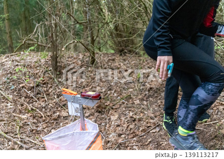 an orienteering control point with an orange flag 139113217