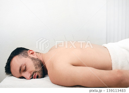 Man caucasian race getting acupuncture treatment. Acupuncture needles close up. Relax in the spa Man caucasian race getting acupuncture treatment. Acupuncture needles close up. Relax in the spa 139113483