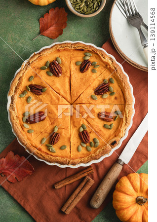 Pumpkin pie, Thanksgiving homemade crust tart, topped with pecan nuts and seeds 139114568