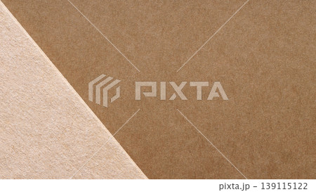 Brown and beige kraft paper layered on a diagonal for a minimal eco packaging background 139115122