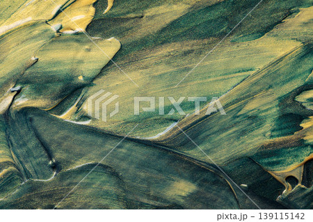 Abstract green and gold oil paint texture with glitter brush strokes and metallic shimmer Abstract green and gold oil paint texture with glitter brush strokes and metallic shimmer 139115142