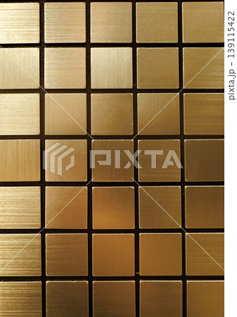 Abstract background of golden brushed metal square tiles. Minimalist geometric mosaic pattern with gold metallic texture and grout lines Luxury design Abstract background of golden brushed metal square tiles. Minimalist geometric mosaic pattern with gold metallic texture and grout lines Luxury design 139115422