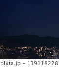 夜の街並みと山のシルエットが美しい静かな夜景（正方形・背景素材） 139118228