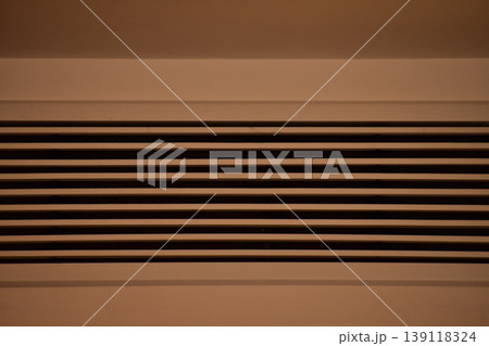 Close-up of central air-conditioner indoors. Home interiors, home furniture, home equipment. Close-up of central air-conditioner indoors. Home interiors, home furniture, home equipment. 139118324