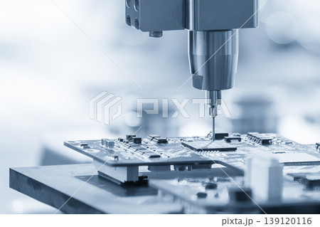 High-tech robotic system assembling electronic components on a PCB board in a smart factory environment. High-tech robotic system assembling electronic components on a PCB board in a smart factory environment. 139120116