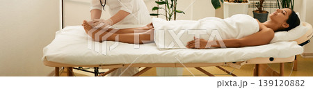 Reflexologist doing acupuncture therapy for patient feet with needles. Acupuncture, reflexology, acupuncture treatment for chronic foot pain 139120882