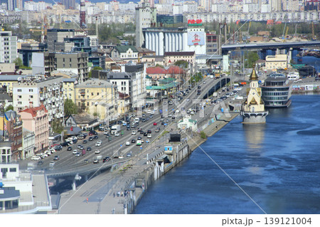 view of the Dnieper embankment in Kyiv. Atmosphere of bustling city on sunny day view of the Dnieper embankment in Kyiv. Atmosphere of bustling city on sunny day 139121004