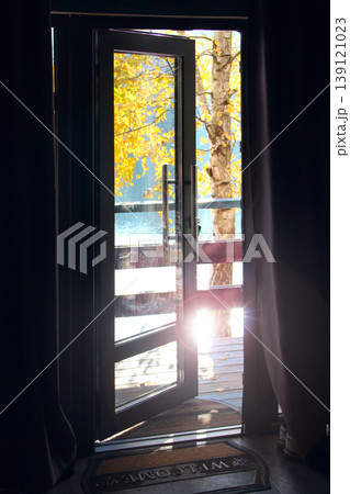 Room ventilation. View of nature from the door. Welcome autumn Room ventilation. View of nature from the door. Welcome autumn 139121023