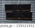 Black DDR5 RAM memory modules placed on a aluminum radiator. RAM shortages on the market, rising prices, and increased demand driven by the growing need for AI training. 139121452