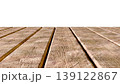 Perspective view of a flat wooden surface with a pronounced texture and annual rings. 139122867