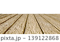 Perspective view of a flat wooden surface with a pronounced texture and annual rings. 139122868