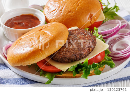Beef cheeseburgers with brioche buns on a plate Beef cheeseburgers with brioche buns on a plate 139123761