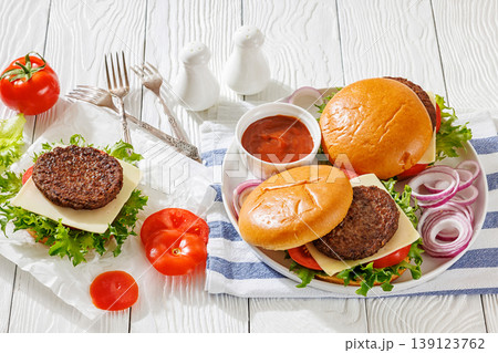 Beef cheeseburgers with brioche buns on a plate Beef cheeseburgers with brioche buns on a plate 139123762