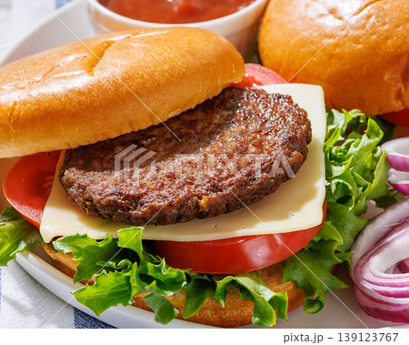 Beef cheeseburgers with brioche buns on a plate Beef cheeseburgers with brioche buns on a plate 139123767