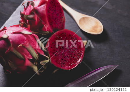 Dragon fruit on a grey granite background. Dragon fruit on a grey granite background. 139124131