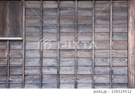 Close up detail of Grunge weathered mossy wooden wall, Vintage wooden wall, Traditional House wall. Close up detail of Grunge weathered mossy wooden wall, Vintage wooden wall, Traditional House wall. 139124512