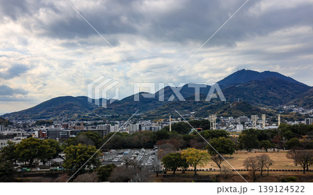 Cityscape skyline on CBD, skyscrapers and office building background with mountain, cloudy day. Cityscape skyline on CBD, skyscrapers and office building background with mountain, cloudy day. 139124522