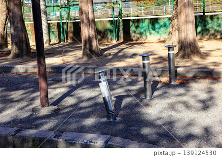 Retractable hydraulic bollard point ( Car barrier ) In operate on street pavement Retractable hydraulic bollard point ( Car barrier ) In operate on street pavement 139124530