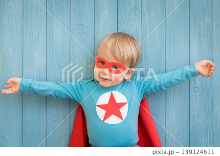Little boy dressed as a superhero having fun at home 139124611