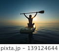 Young woman walking on sup board by the sea during summer vacation 139124644
