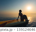 Young woman walking on sup board by the sea during summer vacation 139124646