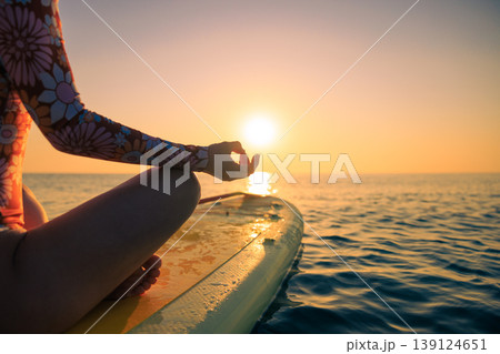 Young woman walking on sup board by the sea during summer vacation 139124651