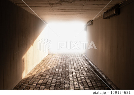 Sunlit urban underpass tunnel leading to a blinding bright exit Sunlit urban underpass tunnel leading to a blinding bright exit 139124681