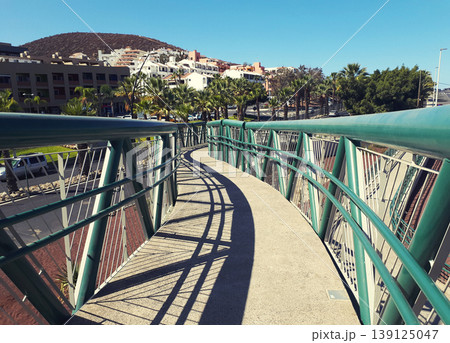 Pedestrian bridge with palm trees in the background in Tenerife Pedestrian bridge with palm trees in the background in Tenerife 139125047