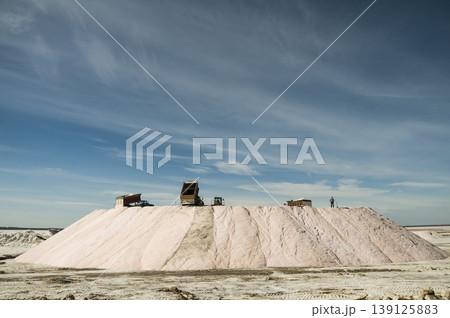 Trucks unloading raw salt bulk, Salinas Grandes de Hidalgo, La Pampa, Argentina. Trucks unloading raw salt bulk, Salinas Grandes de Hidalgo, La Pampa, Argentina. 139125883