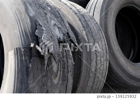 Pile of used car tires ready for recycling. Stacked old tires in a recycling yard. Pile of used car tires ready for recycling. Stacked old tires in a recycling yard. 139125932