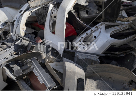 Old and damaged car bumpers collected for recycling. Old and damaged car bumpers collected for recycling. 139125941
