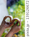 Hands holding open book shaped as heart, love reading concept 139126672
