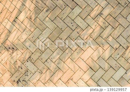 Looking down view of brown bricks used as outdoor flooring 139129957